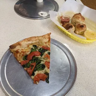 a slice of pizza on a plate