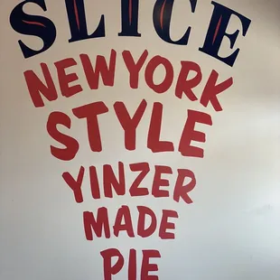 a sign for slice new york style vinker made pie