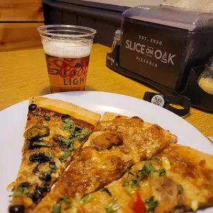 three slices of pizza and a glass of beer