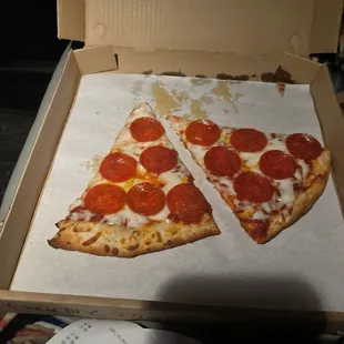 Two slices of pepperoni pizza