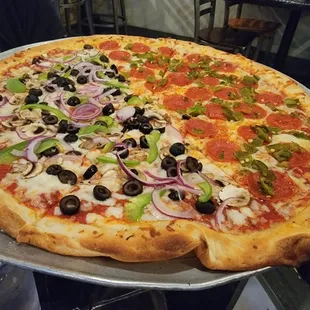 Half veggie and Zia pizza. Zia  is pepperoni and green chili