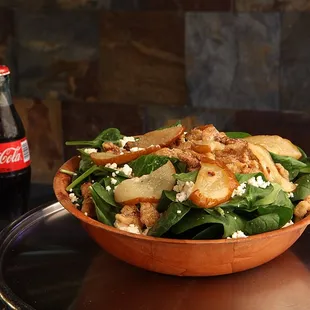 Pear and Goat Cheese Salad with candied walnuts and grilled pears over spinach