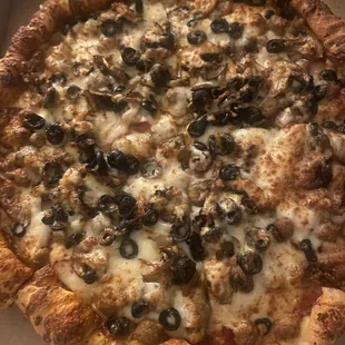 Cheese, beef pepperoni, and beef sausage.Oh also with mushrooms and olives.