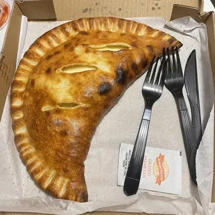 Calzone. Yummy!!  Get this into your mouth.