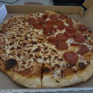 a pepperoni pizza in a box