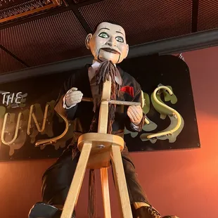 a statue of a man on a ladder