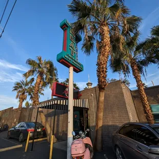 a scooter parked in front of a restaurant