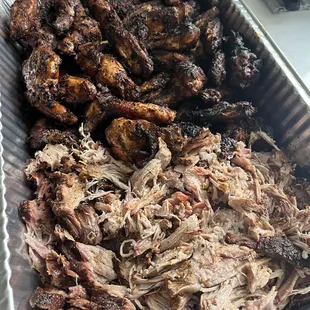 A tray of Victory Pulled Pork Butt and Finger Licking Wangs