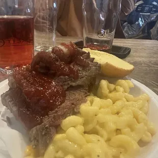 A plate of Vivescent Brisket sandwich topped with Rory&apos;s Specialty Applesauce Barbecue Sauce and a side of Beast Mode Mac and Cheese