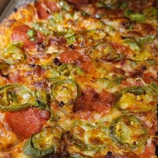 pepperoni, bacon, chorizo, bellpeppers, jalapeños, and onion.