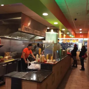 a man preparing food in a restaurant