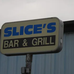 sign for slice&apos;s bar and grill
