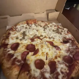 Cold, sloppy , 1/2 pepperoni 1/2 sausage and onion pizza