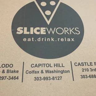 a pizza box with a slice of pizza on it