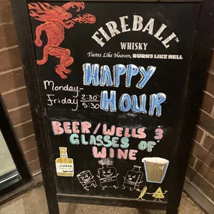 a sign for a happy hour