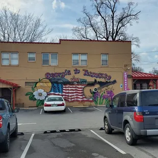 two cars parked in a parking lot