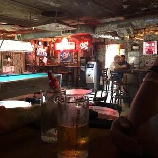 a pool table with a pool table in the background