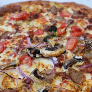 a close up of a sliced pizza
