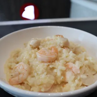 a bowl of risotto with shrimp
