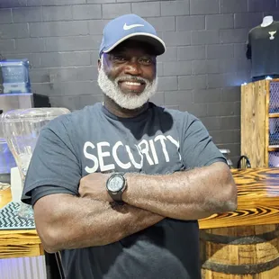 a man standing in front of a barrel