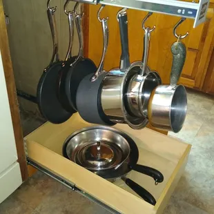 These pot racks with a slide out shelf are the perfect combination for the home cook!