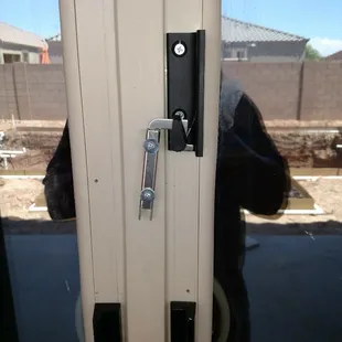 This is a New style latch on a Bi-parting door. Also known as a Butterfly door (because it opens and closes in the middle).