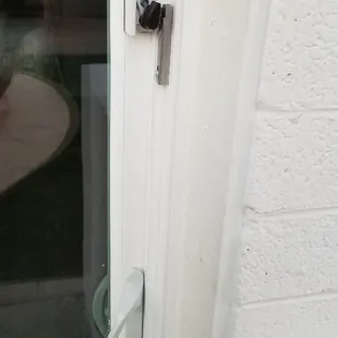 New style latch on the outside of a single sliding door.