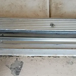 This is an "A" Frame overlay stainless steel track that will replace the damaged track.