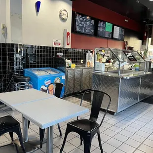 a table and chairs in a restaurant