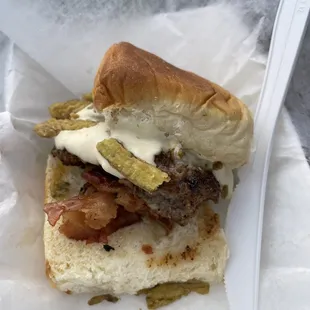 a sandwich with pickles and cheese