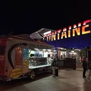  food truck parked in front of a restaurant