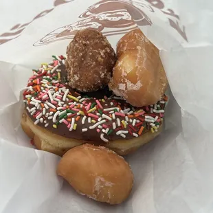 Donut with chocolate sprinkles and donut holes (including a crumb donut hole!)