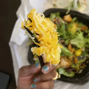 The clump of melted cheese in the other corner