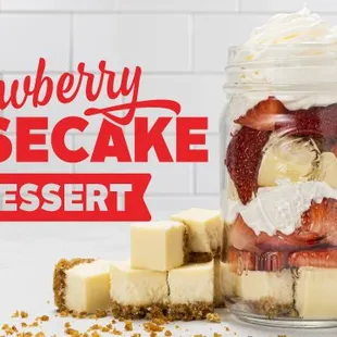 a jar of cheesecake and strawberries