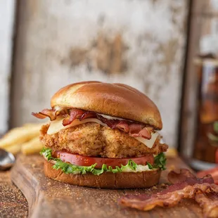 a chicken sandwich with bacon and lettuce