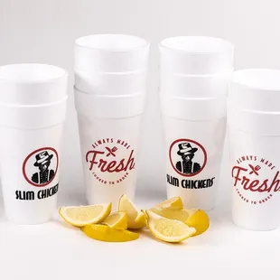 four cups with lemon slices