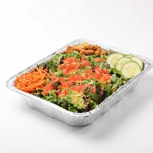 a salad in a foil container