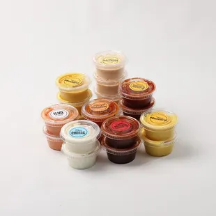a variety of small containers of food