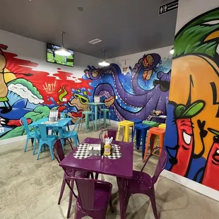 a colorful mural in a restaurant