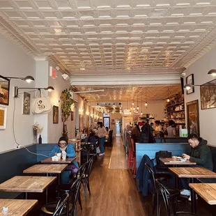 a dining area with tables and chairs