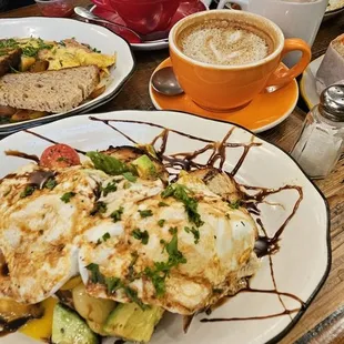 a plate of food and a cup of coffee