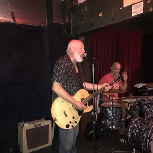 a man playing a guitar