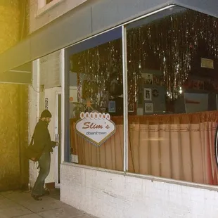 a man walking in front of a store