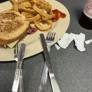 Reuben sandwich and onion rings.