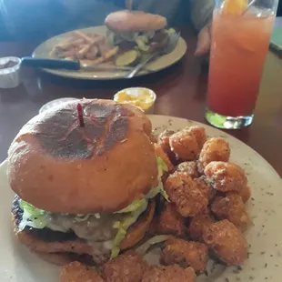 Veggie deluxe burger &amp; tots with a sex on beach drink