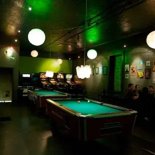 a pool table in the middle of the room