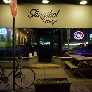 a bicycle parked in front of a restaurant