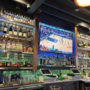a sports bar with a large screen tv