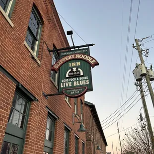 a sign for slippery noodle inn