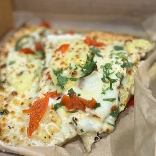 a slice of pizza in a box